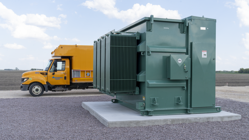 A Manitoba Hydro truck positioned with a newly installed transformer.