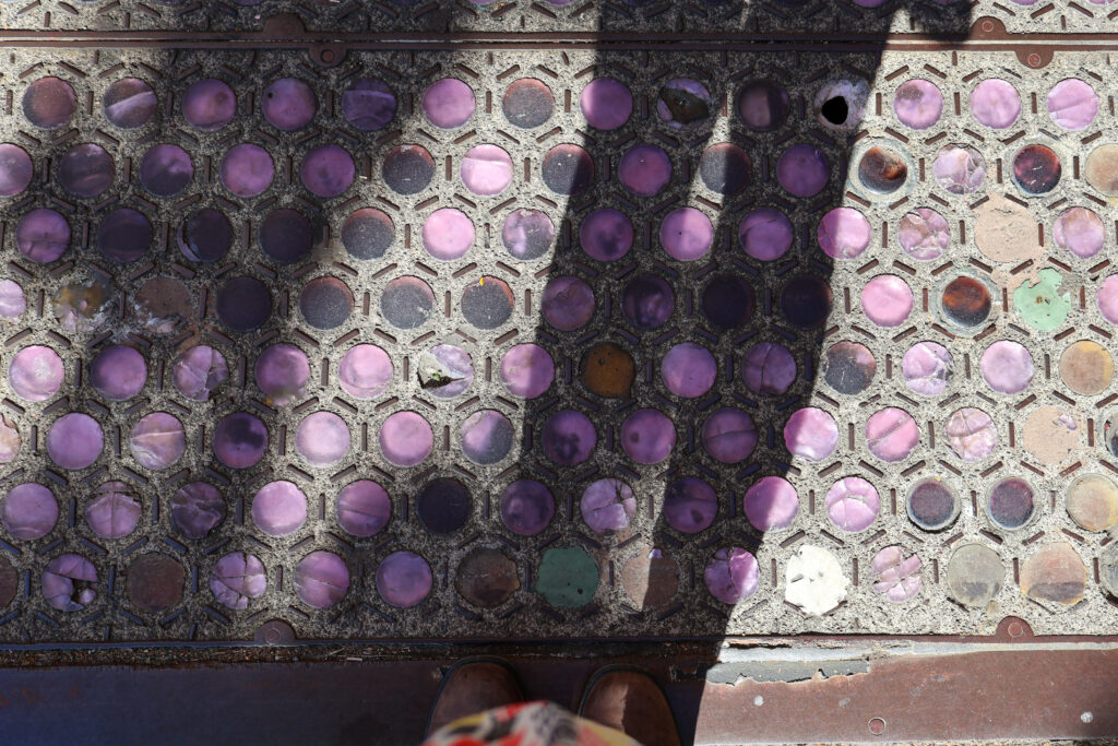 Purple and blue glass accents in the sidewalks of downtown Seattle.