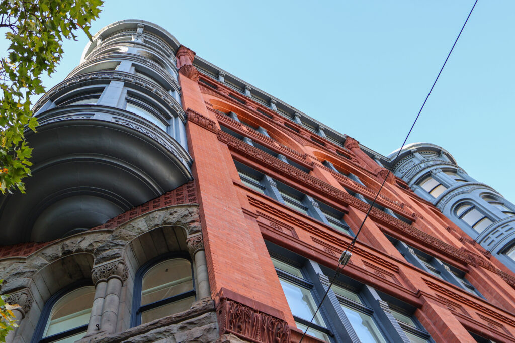 A blue and red building in downtown Seattle.